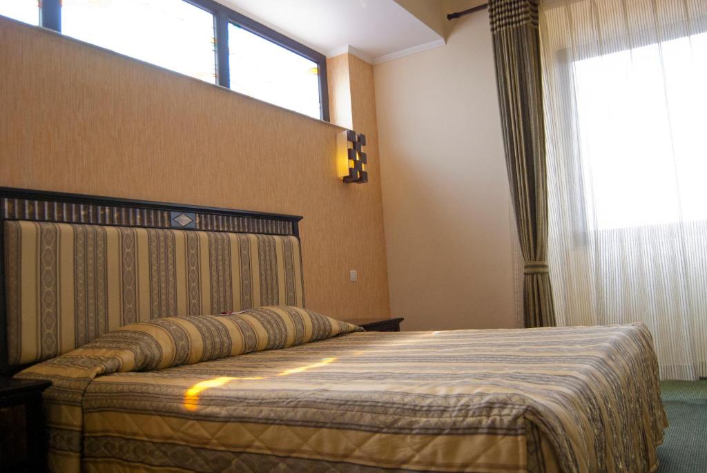 Postel nebo postele na pokoji v ubytování Hotel Tecadra
