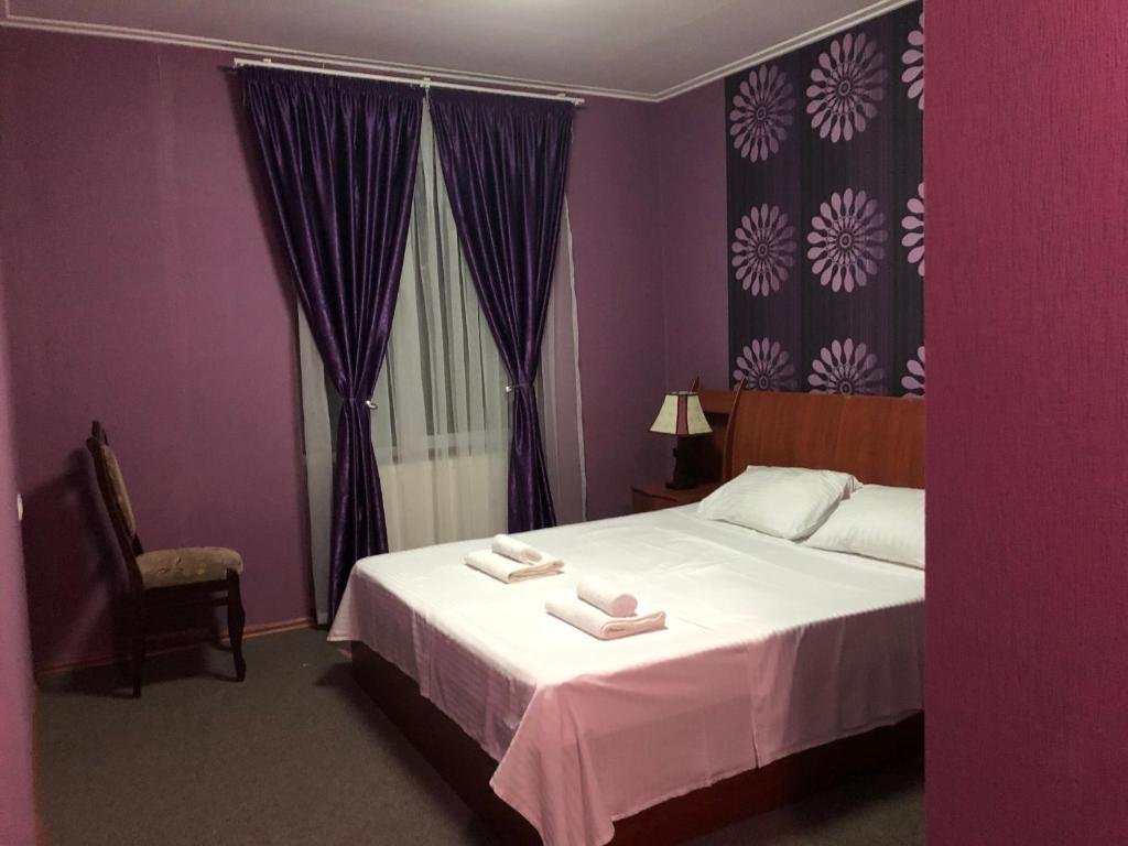 Postel nebo postele na pokoji v ubytování Park Hotel Imeri kutaisi