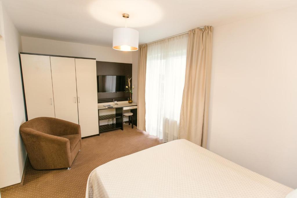 Postel nebo postele na pokoji v ubytování Hotel International