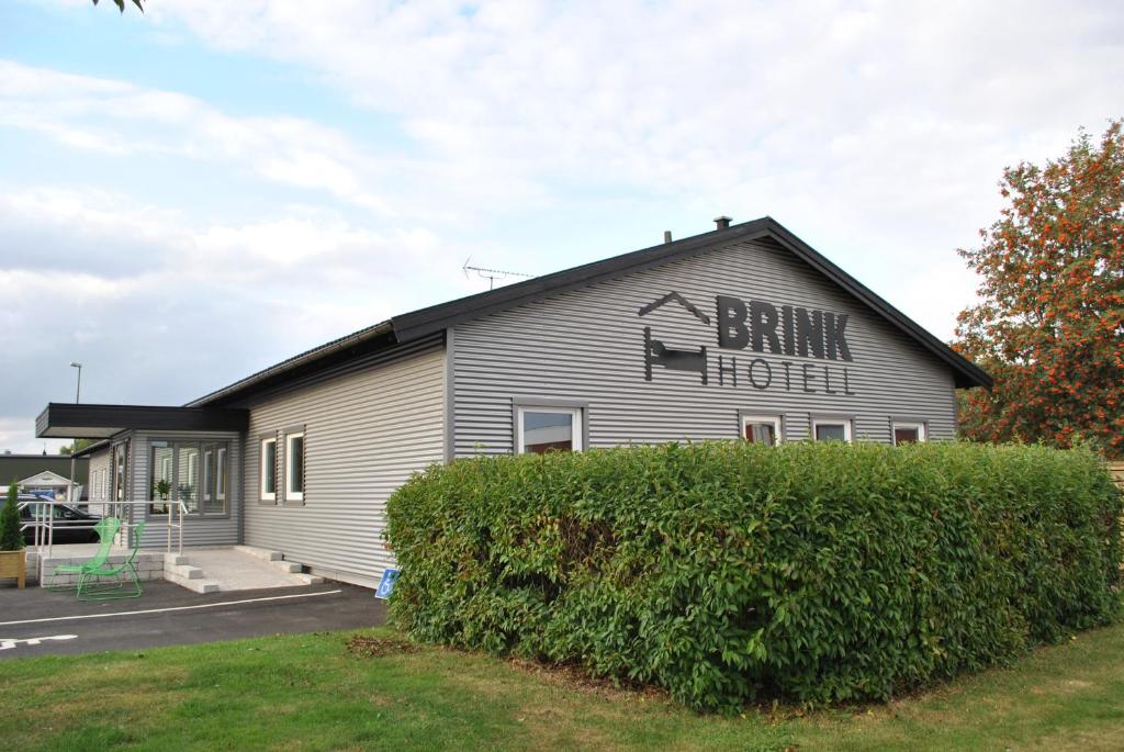 a building with a sign on the side of it at Brink Hotell in Eslöv