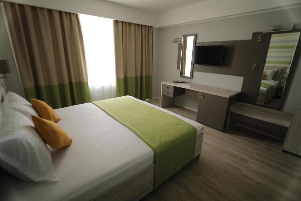 Postel nebo postele na pokoji v ubytování Hotel Dedal