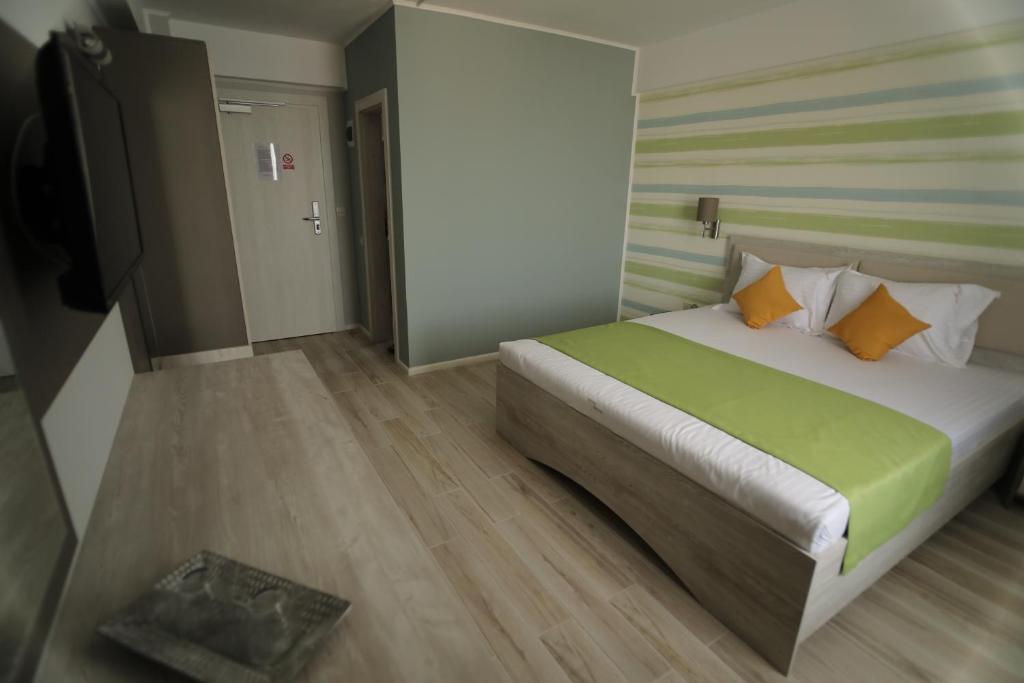 Postel nebo postele na pokoji v ubytování Hotel Dedal