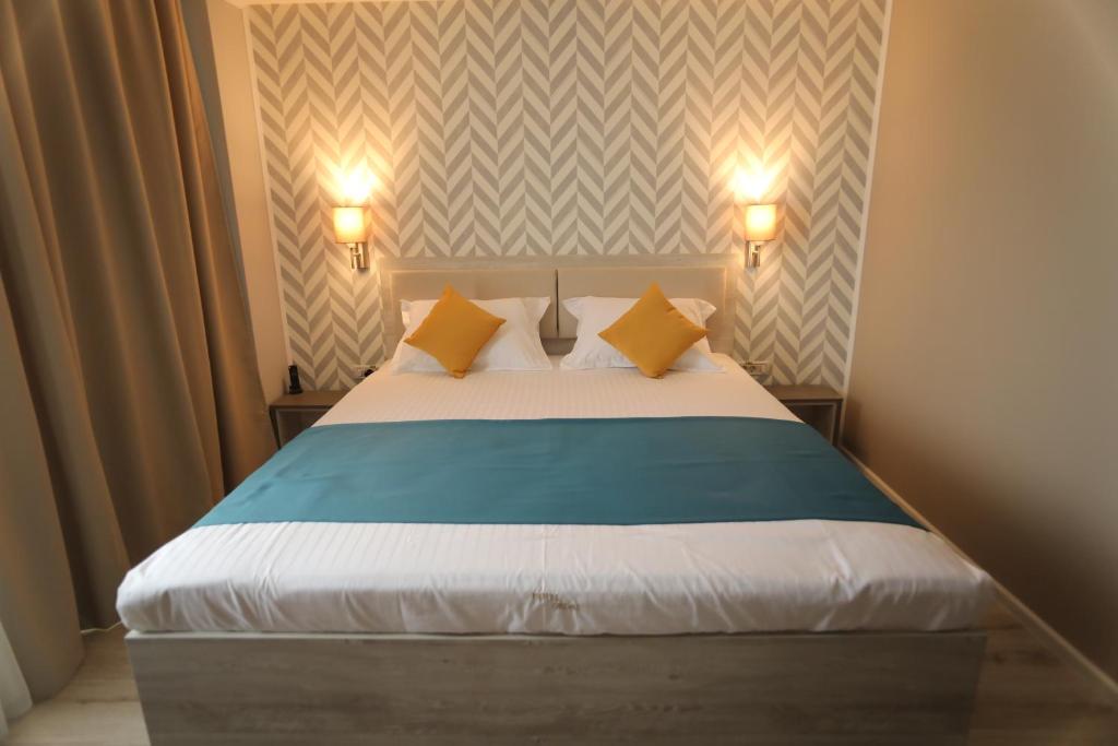 Postel nebo postele na pokoji v ubytování Hotel Dedal