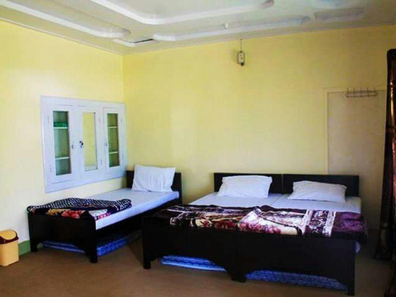 A bed or beds in a room at Chikar Highland Resort