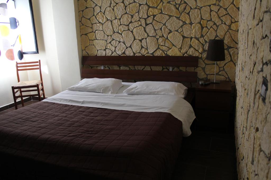 Postel nebo postele na pokoji v ubytování Hotel 106
