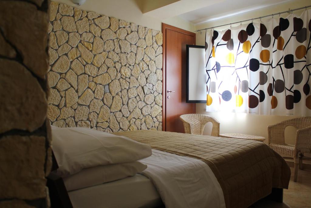 Postel nebo postele na pokoji v ubytování Hotel 106