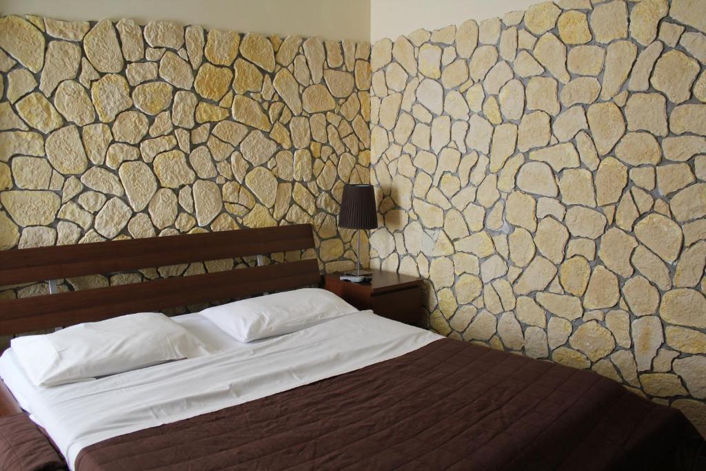 Postel nebo postele na pokoji v ubytování Hotel 106