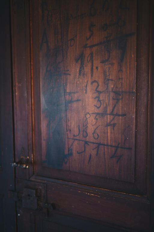 a wooden door with writing on the side of it at La Torretta in Lerici