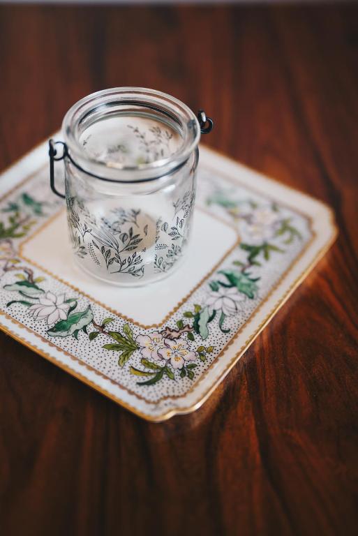 a glass jar on a plate on a table at La Torretta in Lerici