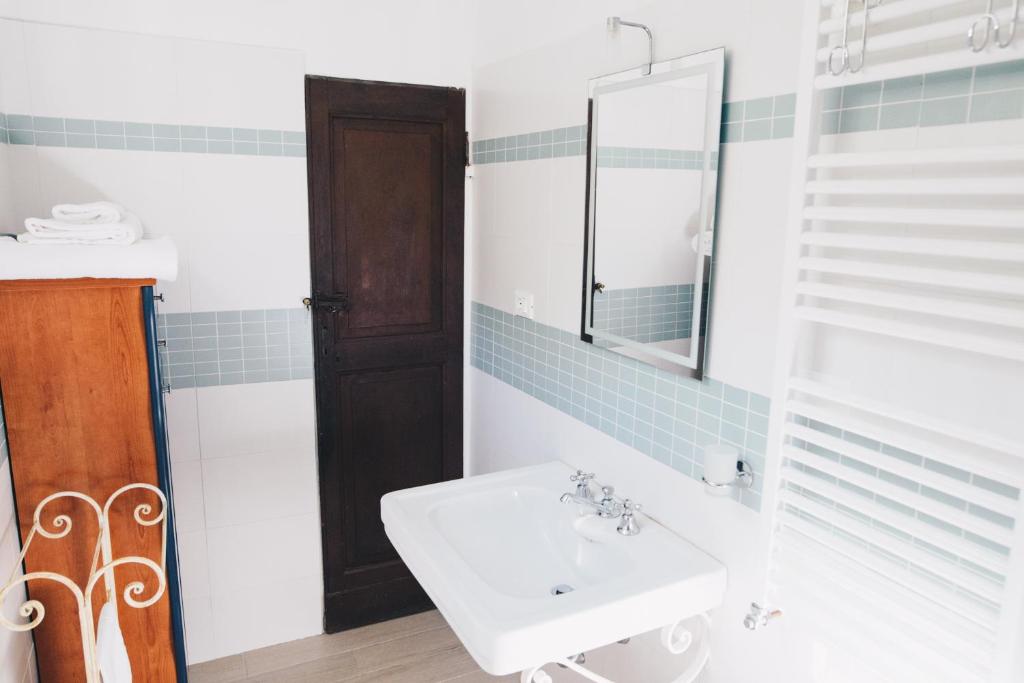a bathroom with a sink and a mirror at La Torretta in Lerici