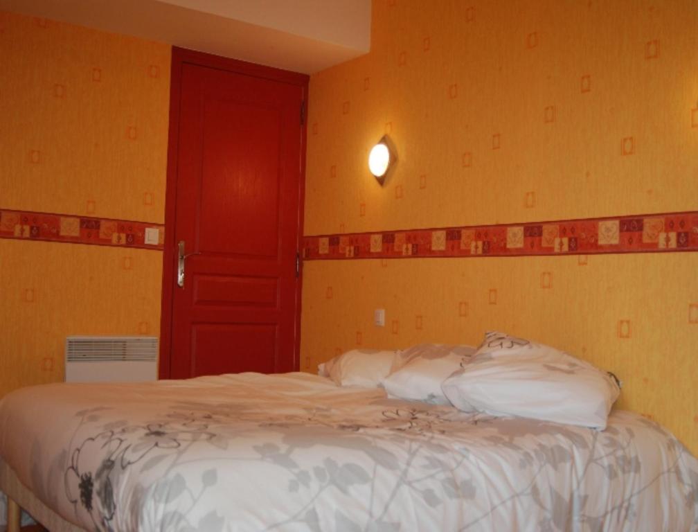 Postel nebo postele na pokoji v ubytování Le Manoir du Butel