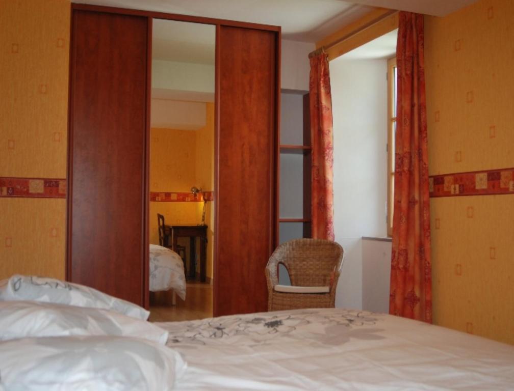 Postel nebo postele na pokoji v ubytování Le Manoir du Butel