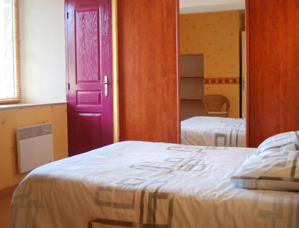 Postel nebo postele na pokoji v ubytování Le Manoir du Butel