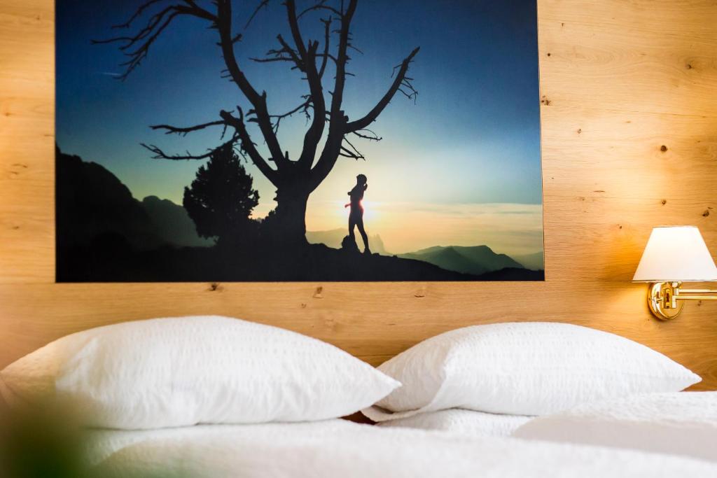 Postel nebo postele na pokoji v ubytování Hotel Garni Morene
