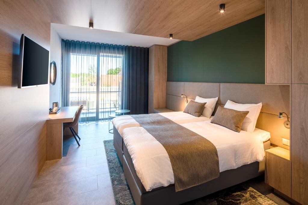 Een bed of bedden in een kamer bij Hotel 46