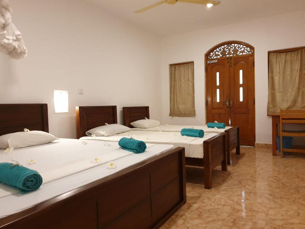 Postel nebo postele na pokoji v ubytování Rupa's Hotel