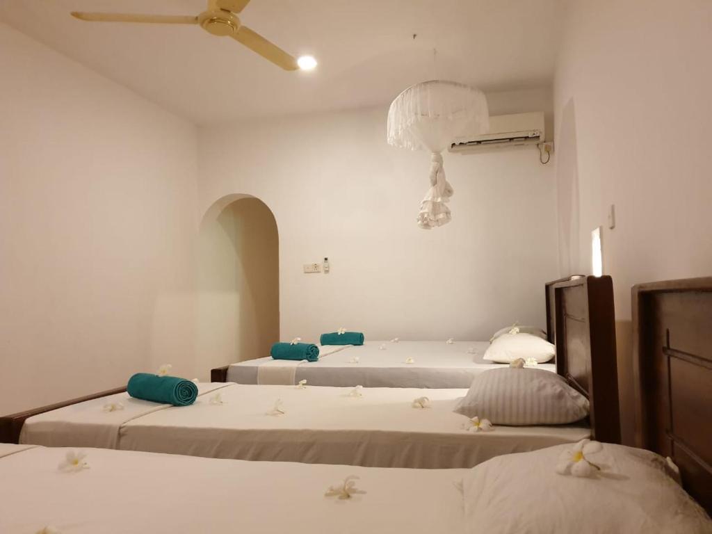 Postel nebo postele na pokoji v ubytování Rupa's Hotel