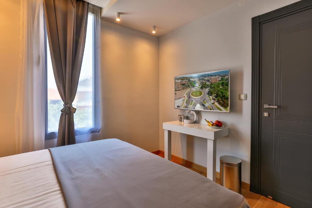 Postel nebo postele na pokoji v ubytování Hotel M