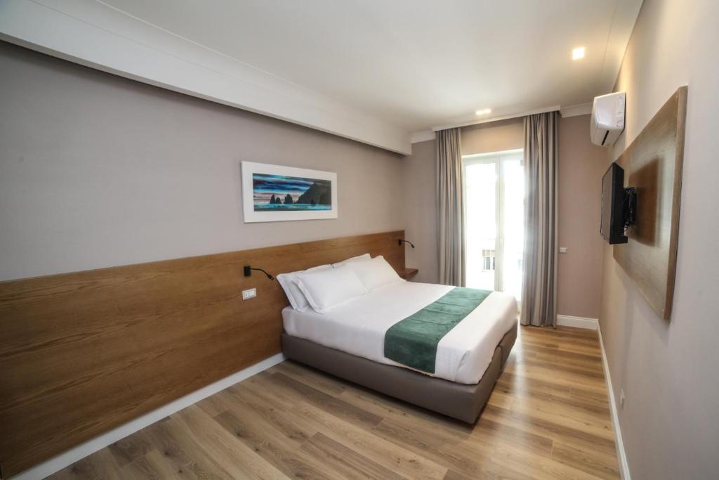 Łóżko lub łóżka w pokoju w obiekcie Toledo Relais Exclusive Rooms - By Pera Rooms Collection