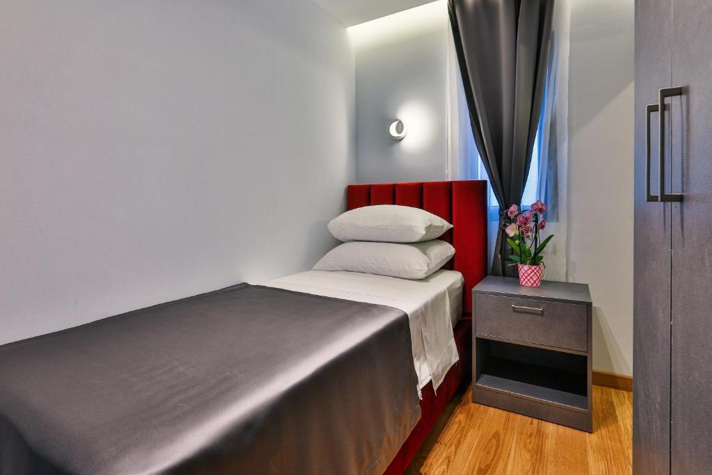 Postel nebo postele na pokoji v ubytování Hotel M