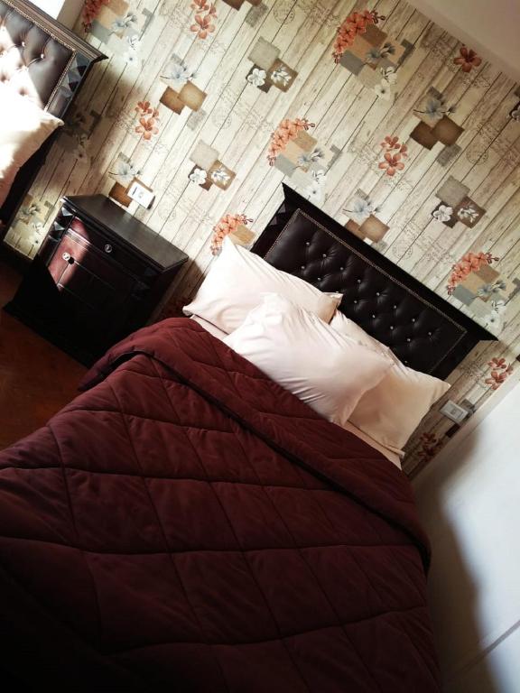 Postel nebo postele na pokoji v ubytování Castle Hostel