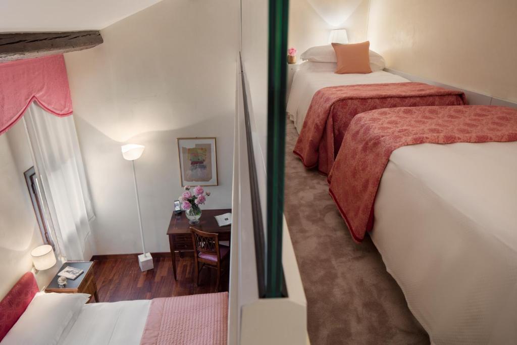 Postel nebo postele na pokoji v ubytování Villa Michelangelo Vicenza – Starhotels Collezione