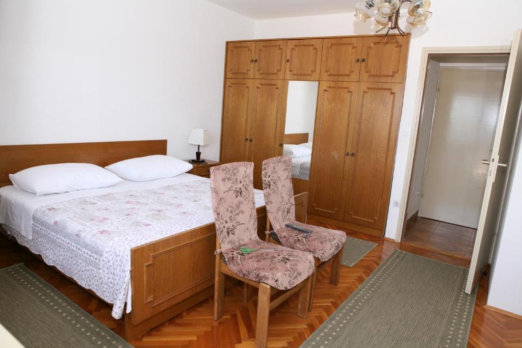Postel nebo postele na pokoji v ubytování Rooms and Apartments Kurtović