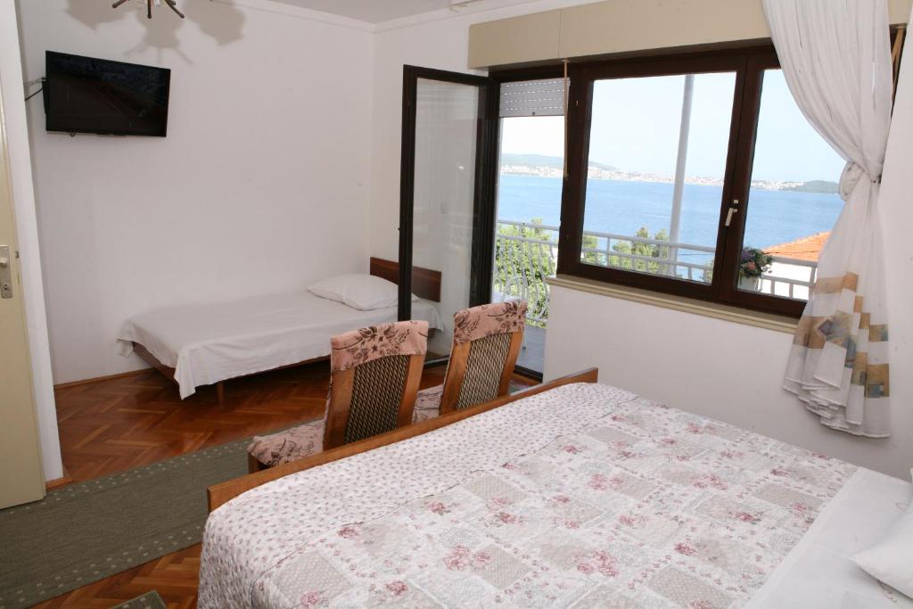 Postel nebo postele na pokoji v ubytování Rooms and Apartments Kurtović