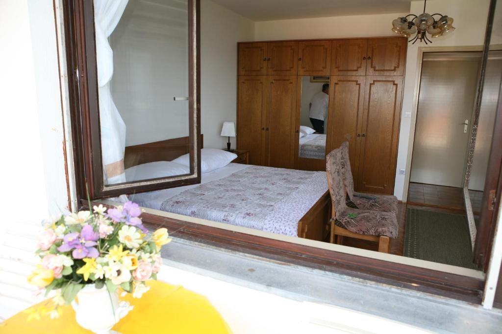 Postel nebo postele na pokoji v ubytování Rooms and Apartments Kurtović