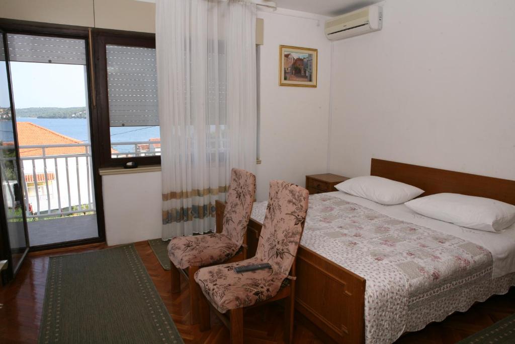 Postel nebo postele na pokoji v ubytování Rooms and Apartments Kurtović
