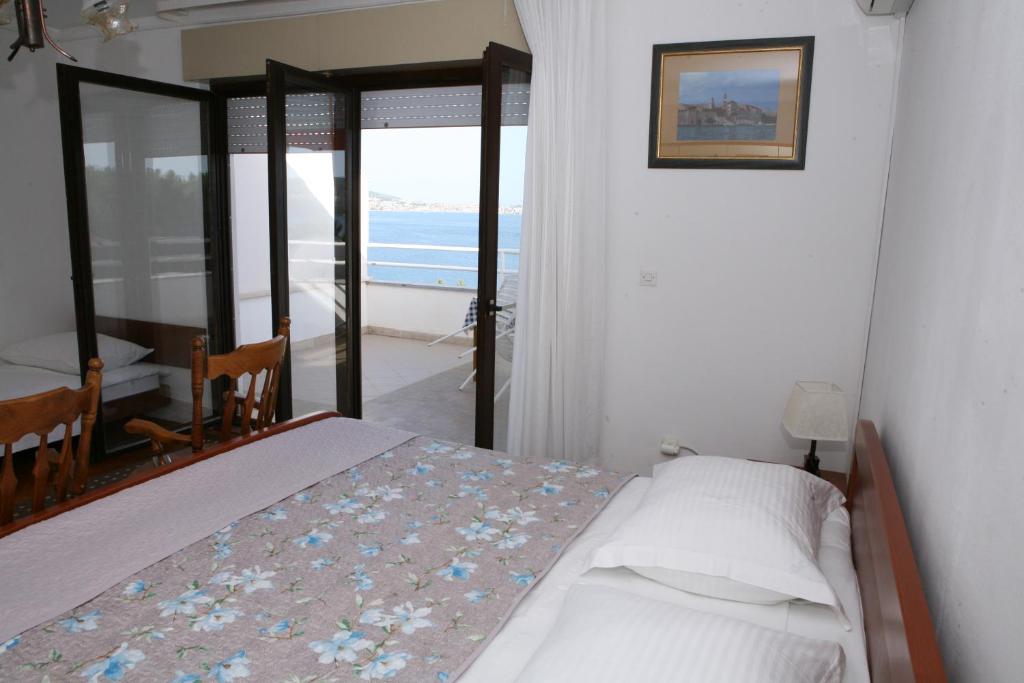 Postel nebo postele na pokoji v ubytování Rooms and Apartments Kurtović