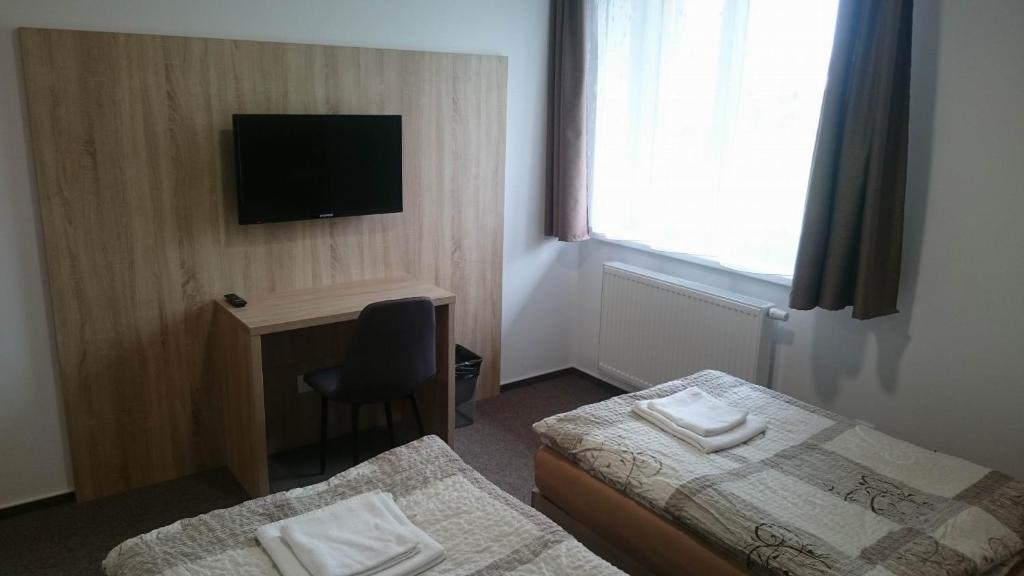 Postel nebo postele na pokoji v ubytování Penzion Skalka