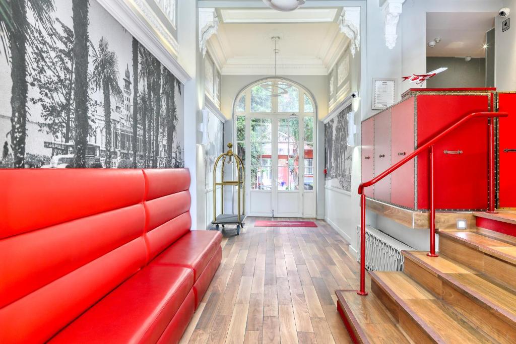 Area soggiorno di Nice Excelsior Centre ville by HappyCulture