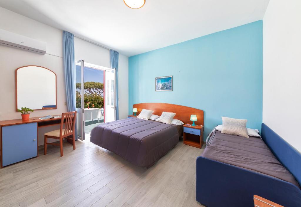 Postel nebo postele na pokoji v ubytování Hotel Costa Citara