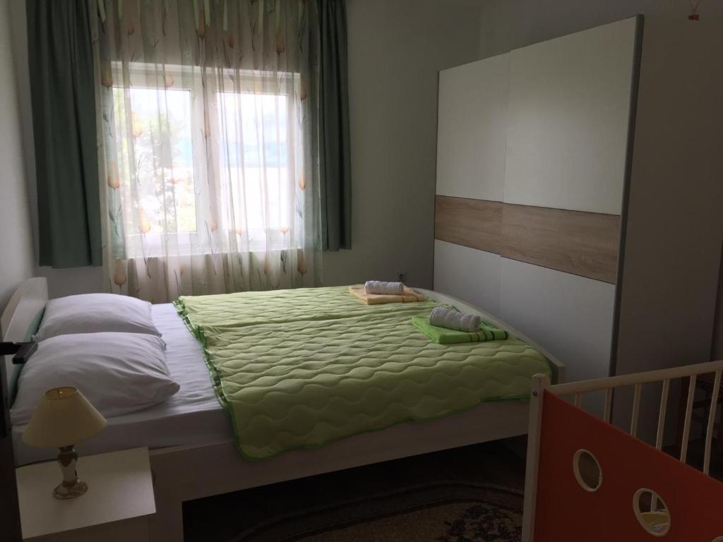 Postel nebo postele na pokoji v ubytování Apartmani Vidikovac