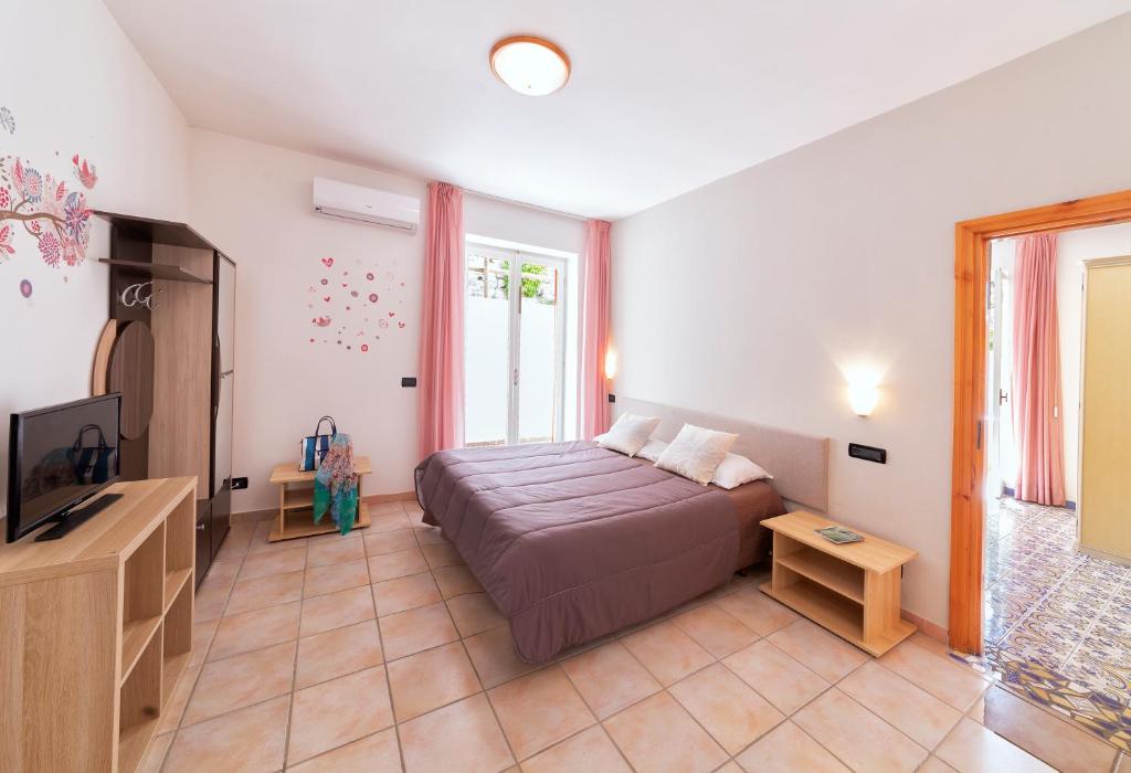 Postel nebo postele na pokoji v ubytování Hotel Costa Citara