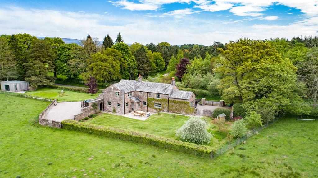 an aerial view of an old house in a field at Rose Cottage in Sandford
