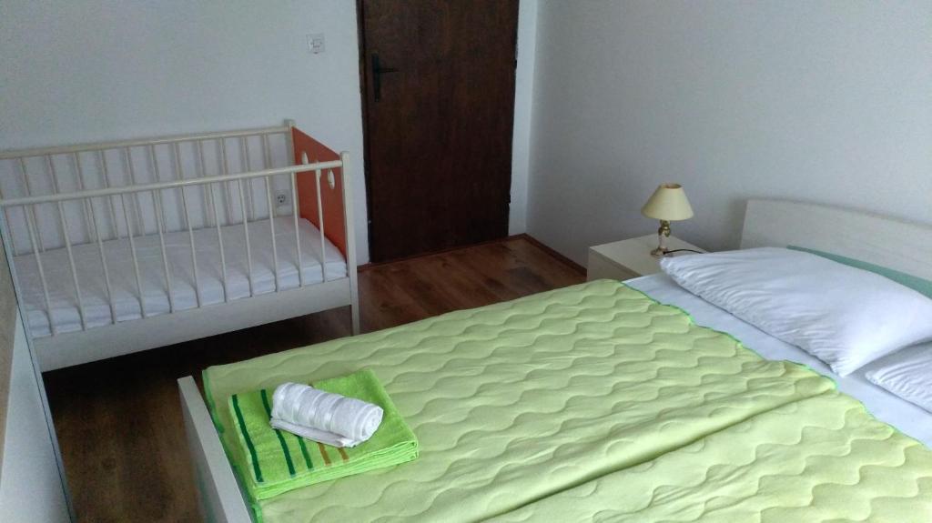 Postel nebo postele na pokoji v ubytování Apartmani Vidikovac