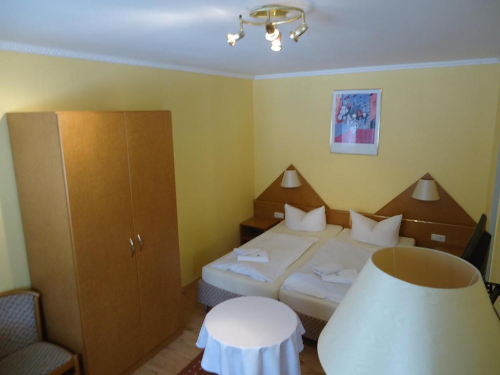 Postel nebo postele na pokoji v ubytování Hotel Ottersleben