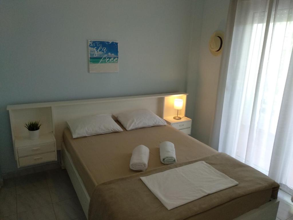 Postel nebo postele na pokoji v ubytování siviri pliades!