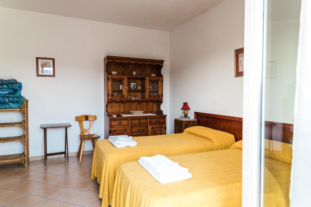 Ein Bett oder Betten in einem Zimmer der Unterkunft Torre Ancinale