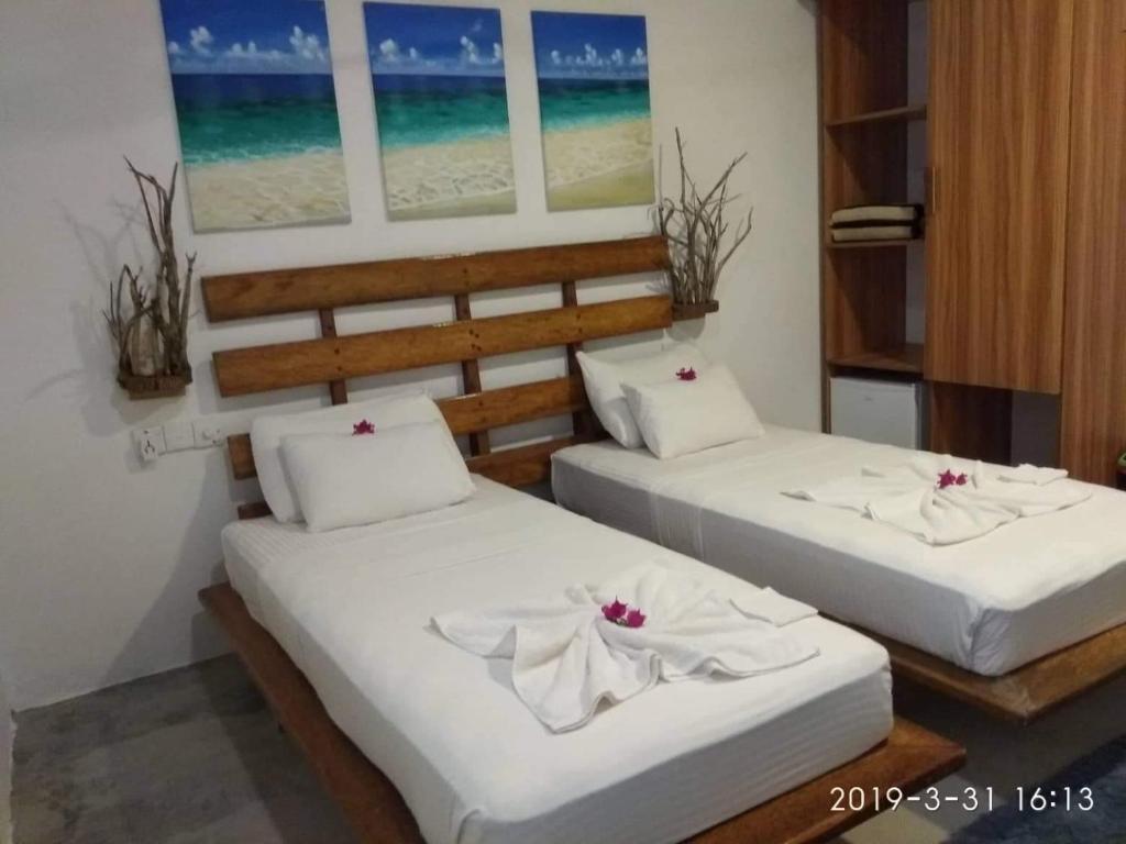 Postel nebo postele na pokoji v ubytování Island Break