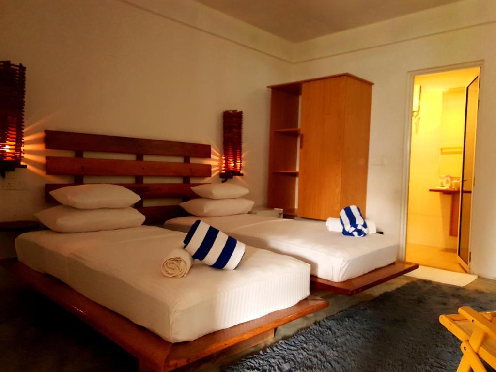 Postel nebo postele na pokoji v ubytování Island Break