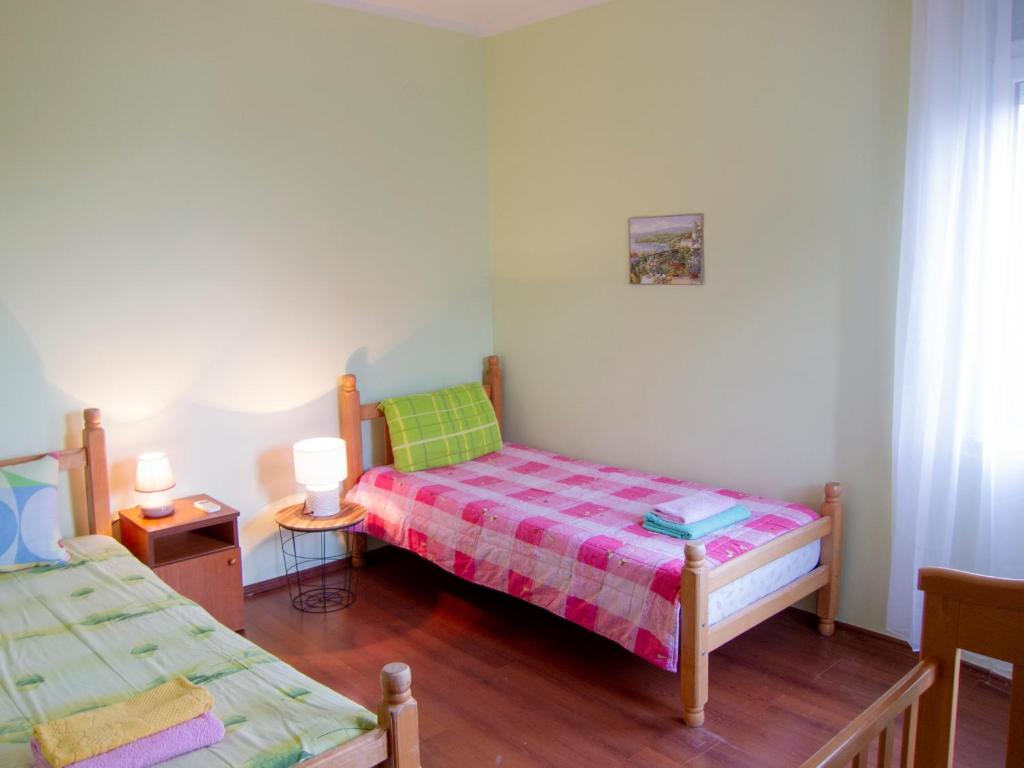 Postel nebo postele na pokoji v ubytování Villa Rossa