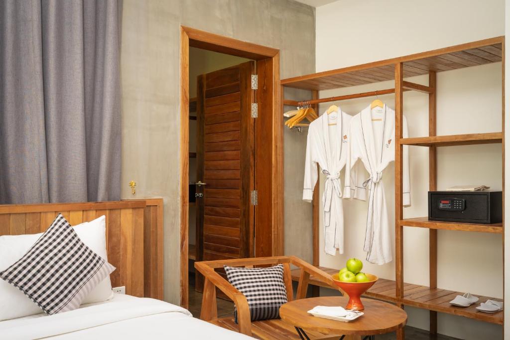 Postel nebo postele na pokoji v ubytování Phka Chan Hotel