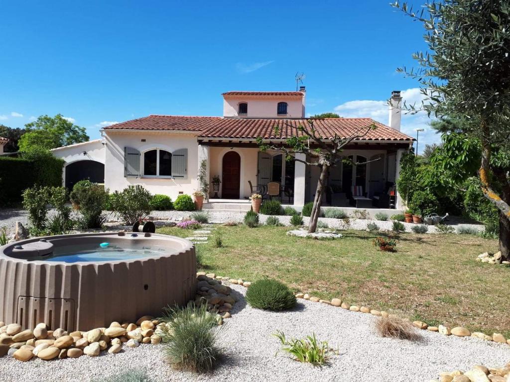 a house with a pool in the yard at Les Coronilles in Saint-Maximin-la-Sainte-Baume