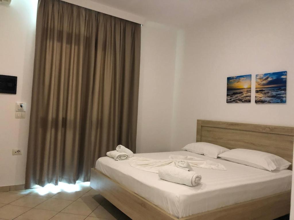 Postel nebo postele na pokoji v ubytování Hotel Jon