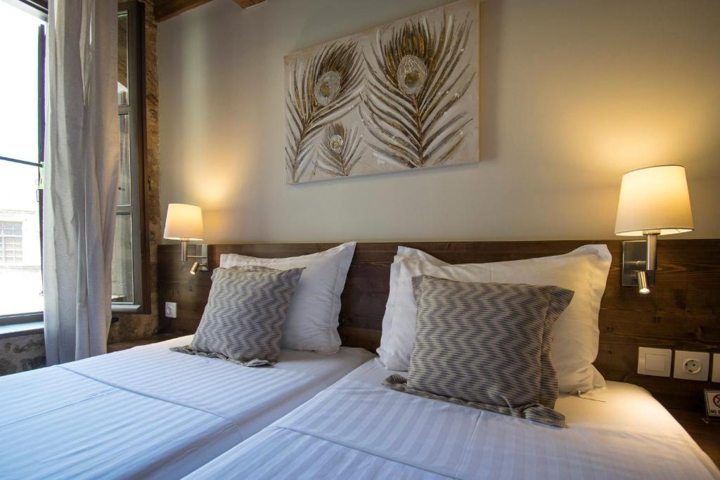 Postel nebo postele na pokoji v ubytování D'Argento Boutique Rooms