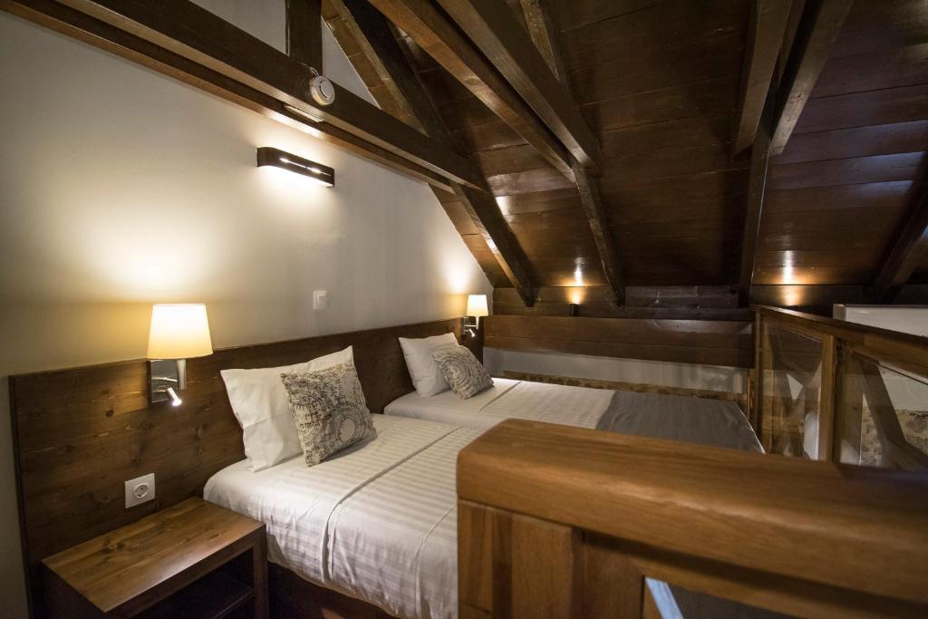 Postel nebo postele na pokoji v ubytování D'Argento Boutique Rooms