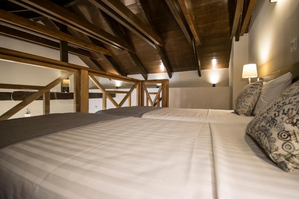 Postel nebo postele na pokoji v ubytování D'Argento Boutique Rooms